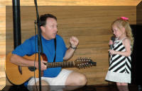 Teagan singing with Dave Kemmerly